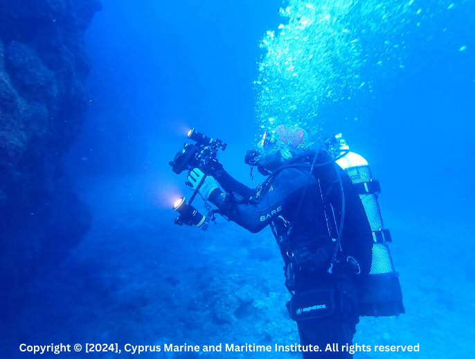 Scuba diver taking a photo underwater